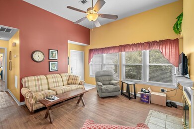 Living room with hardwood / wood-style floors and 