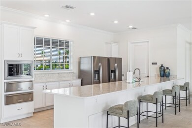 Kitchen featuring white cabinets, stainless steel