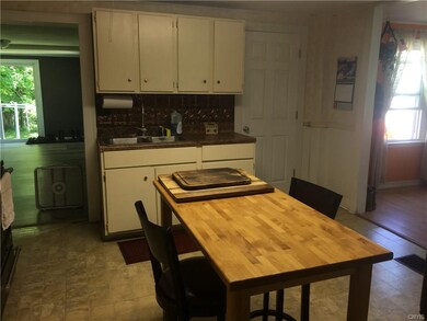 Old style kitchen with island butcher block.