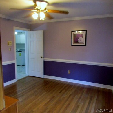 Formal dining room with chair rail, crown molding,