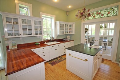 The kitchen has Beautiful wood Counter tops and la