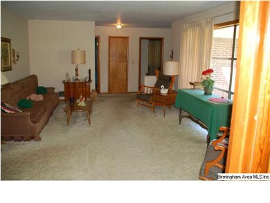 LOOKING THRU LIVING ROOM INTO FOYER