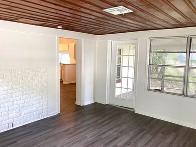 Head towards the dining room and kitchen