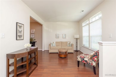 Living area featuring dark wood-style flooring and