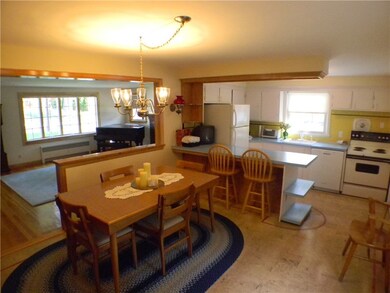 Dinning room looking into kitchen and living room