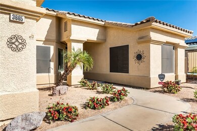 Property entrance with a tiled roof and stucco sid