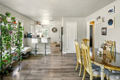 Dining area featuring wood finished floors and baseboards
