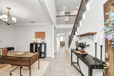 The open entry way showcases the study/office to the left