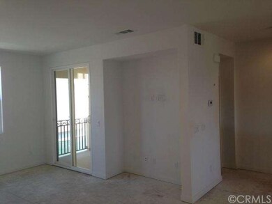 Living room TV niche and covered deck.