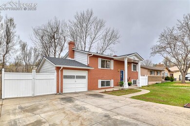 View of property exterior with concrete driveway, 