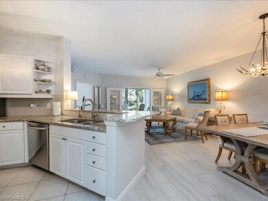 Kitchen featuring white cabinets, kitchen peninsul
