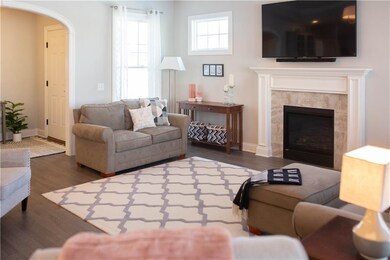 The Gas Fireplace and Hardwood Flooring Warm the G