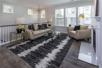 The gathering room has so much light, gas fireplac