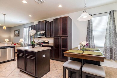 Eat-in kitchen with center island.