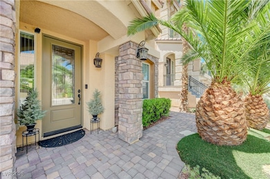 Entrance to property with stucco siding
