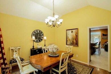 A formal dining room adjacent to  the kitchen.