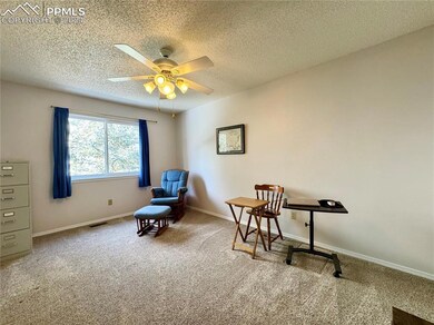 Third Main Level Bedroom with Ceiling Fan.
