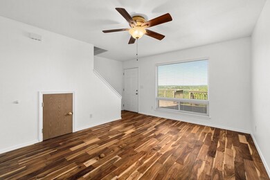 Empty room featuring dark wood-type flooring, bas