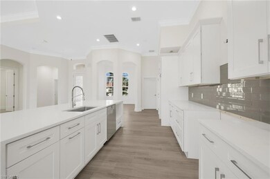 Kitchen featuring visible vents, backsplash, dishw