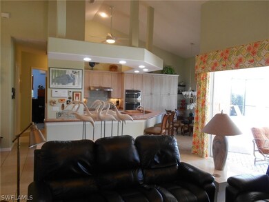 Open kitchen with high ceilings.