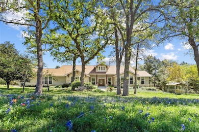 View of front of property with roof with shingles