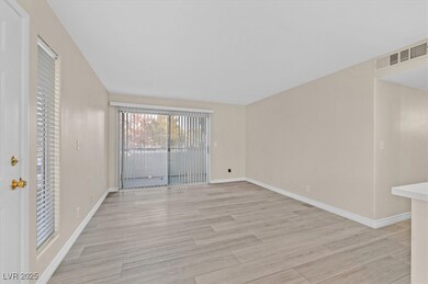 Spare room featuring light wood-style floors, base