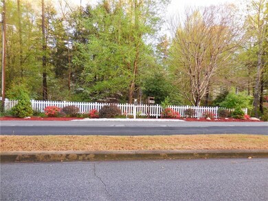 This pretty property faces the landscaped boulevard entrance to Foxwood Hills.