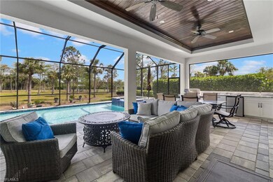 Sunroom with a pool, a tray ceiling, wooden ceilin