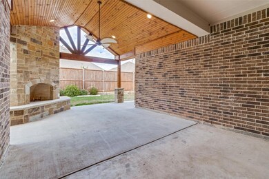 Enjoy entertaining outdoors with this fireplace an