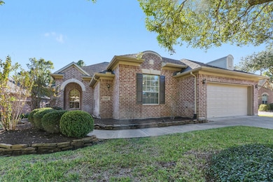 Lovely brick home features beautiful curb appeal with classic architectural details and an arched entryway A two-car garage and inviting front walkway.