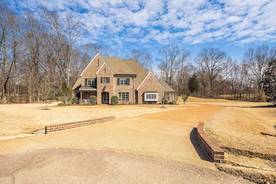 View of front facade featuring brick siding