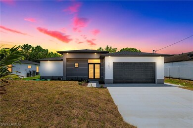 View of front of property with stucco siding, conc