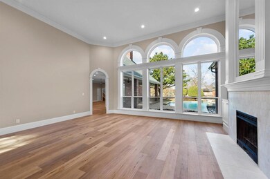 Formal living overlooks the pool & patio