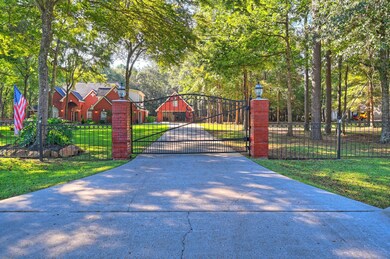 As you drive up the extended paved driveway, you p