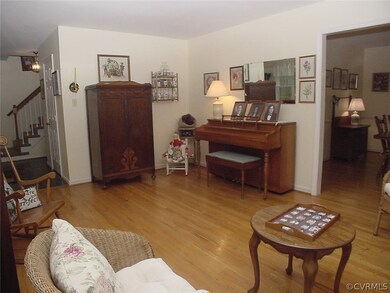 Living room is open to foyer and dining room