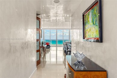 Private foyer entrance leads the way to plenty of walls for art