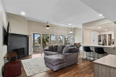 Living Room with Water View and Gas/Wood-burning F