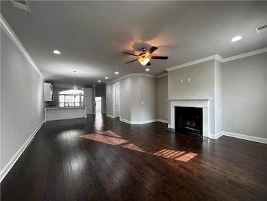 Unfurnished living room featuring a fireplace, a c