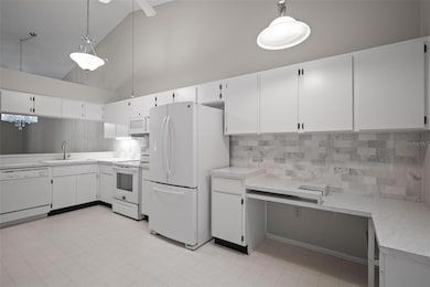 Large open kitchen with extra shelving and a pantry