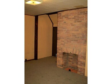 Living Room. Exposed brick chimney