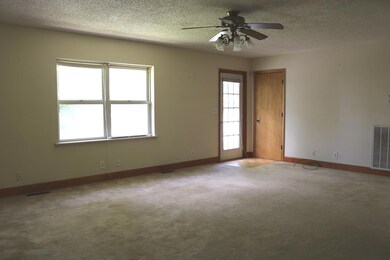Once inside, we find an extra large living room that opens to the dining room. 