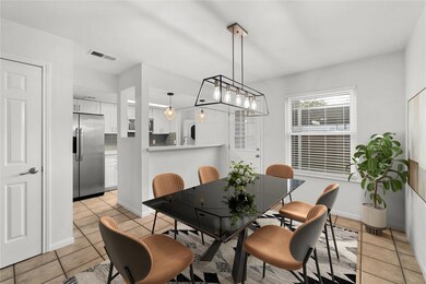 Dining room featuring baseboards, visible vents, 