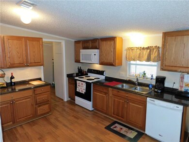 Range, microwave hood, dishwasher and double stain