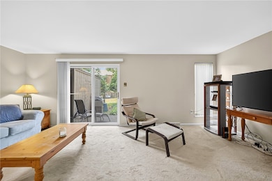 Sliding glass door leads to private patio
