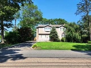 View of front of property with a front yard