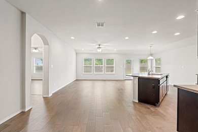 Kitchen featuring ceiling fan, recessed lighting,