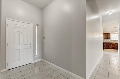 Nice ceramic entry welcomes you to a beautiful open living, dining,kitchen area. Coat closet is not shown in this picture.