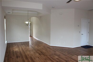 DINING/LIVING AREA W/WOOD FLOORS