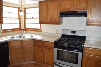 New light over sink. New sink faucet. New counter 