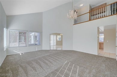 Enter into the living room with vaulted high ceilings